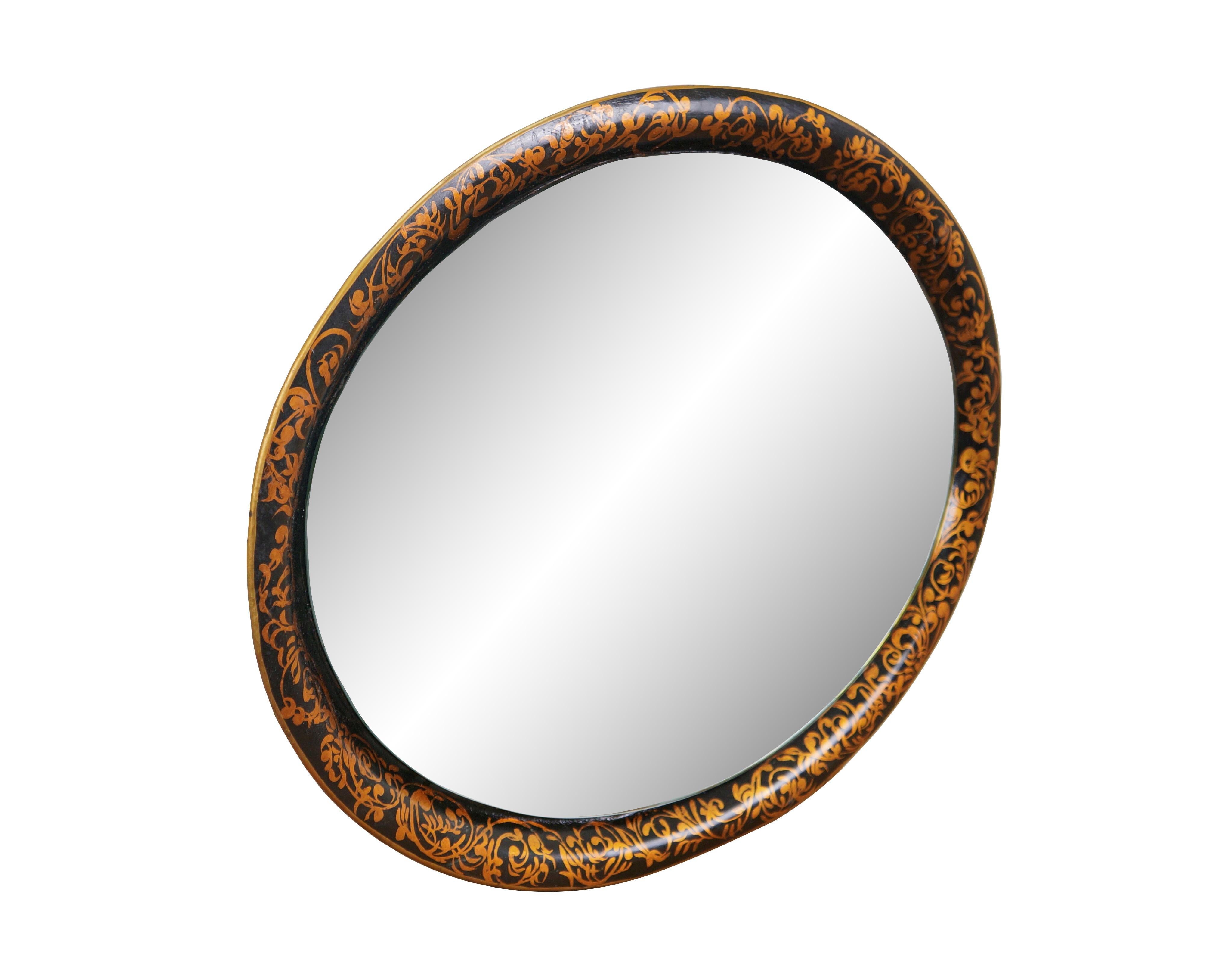 Vintage black metal tolware tray with added mirror and wire for use as a wall mirror. Oval shape with curved edge, hand painted with a swirling gold foliate design. Marked 