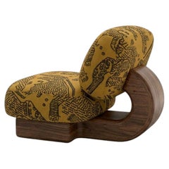 Orla Armchair Upholstered in fabric Tiger Mountain and walnut structure