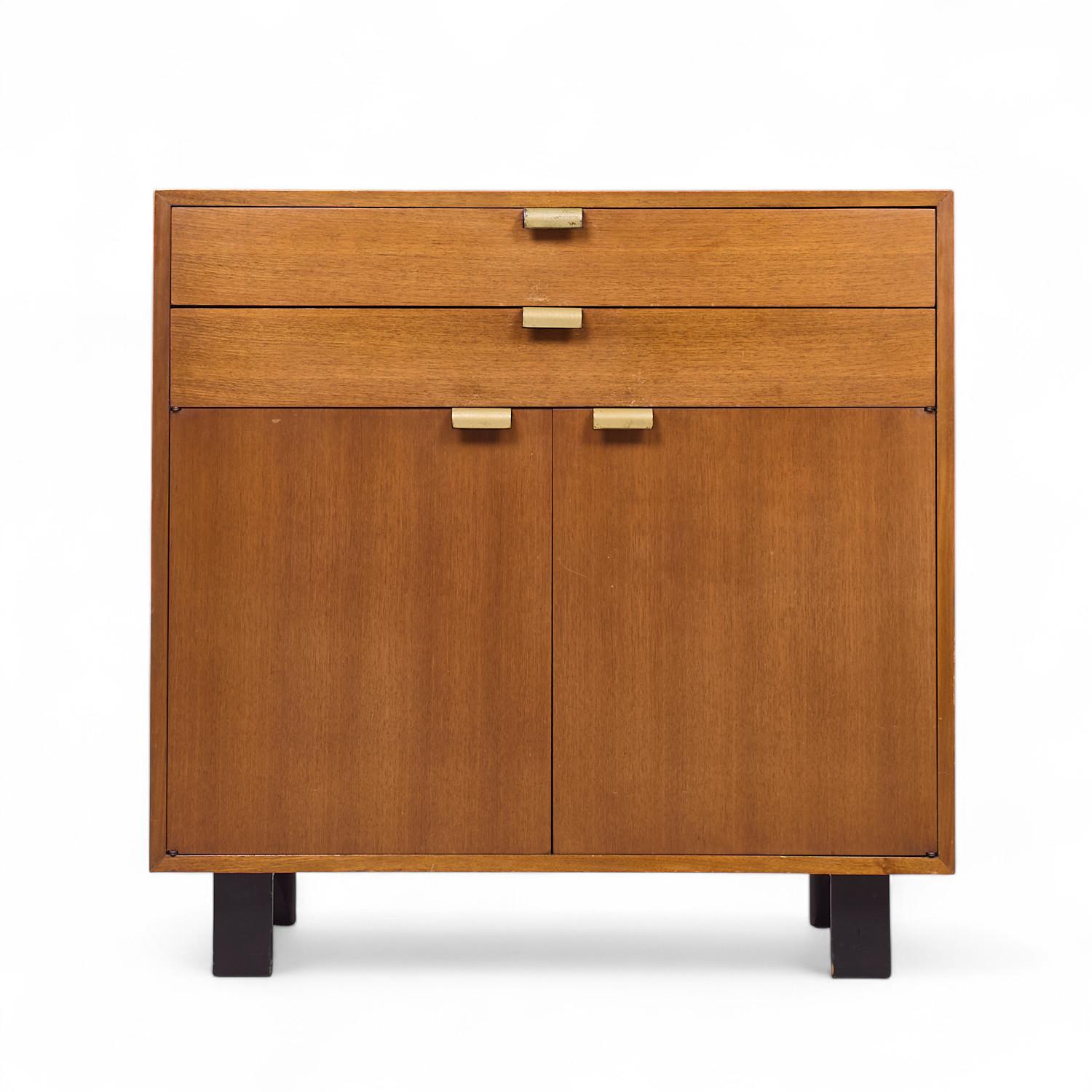 George Nelson for Herman Miller Mid Century Basic Series Walnut Bar Cabinet

This bar cabinet measures: 40 wide x 18.5 deep x 39.5 inches high

All pieces of furniture can be had in what we call restored vintage condition. That means the piece is