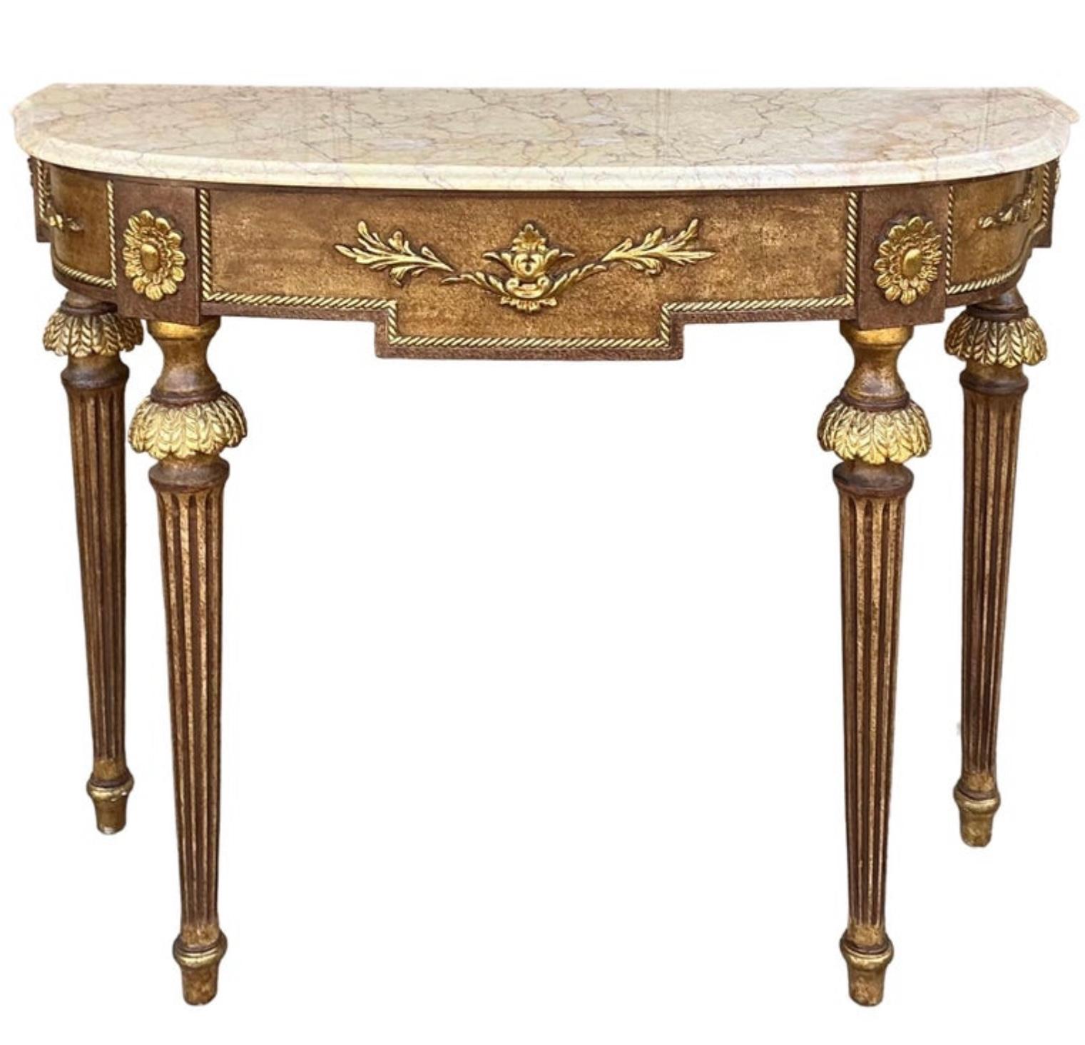 This is a wonderful pair of Italian console tables with beautiful marble tops. They have French Louis XVI styling and were hand crafted by Decorative Crafts. They are marked and in near perfect condition.

Shipping is running two to five weeks