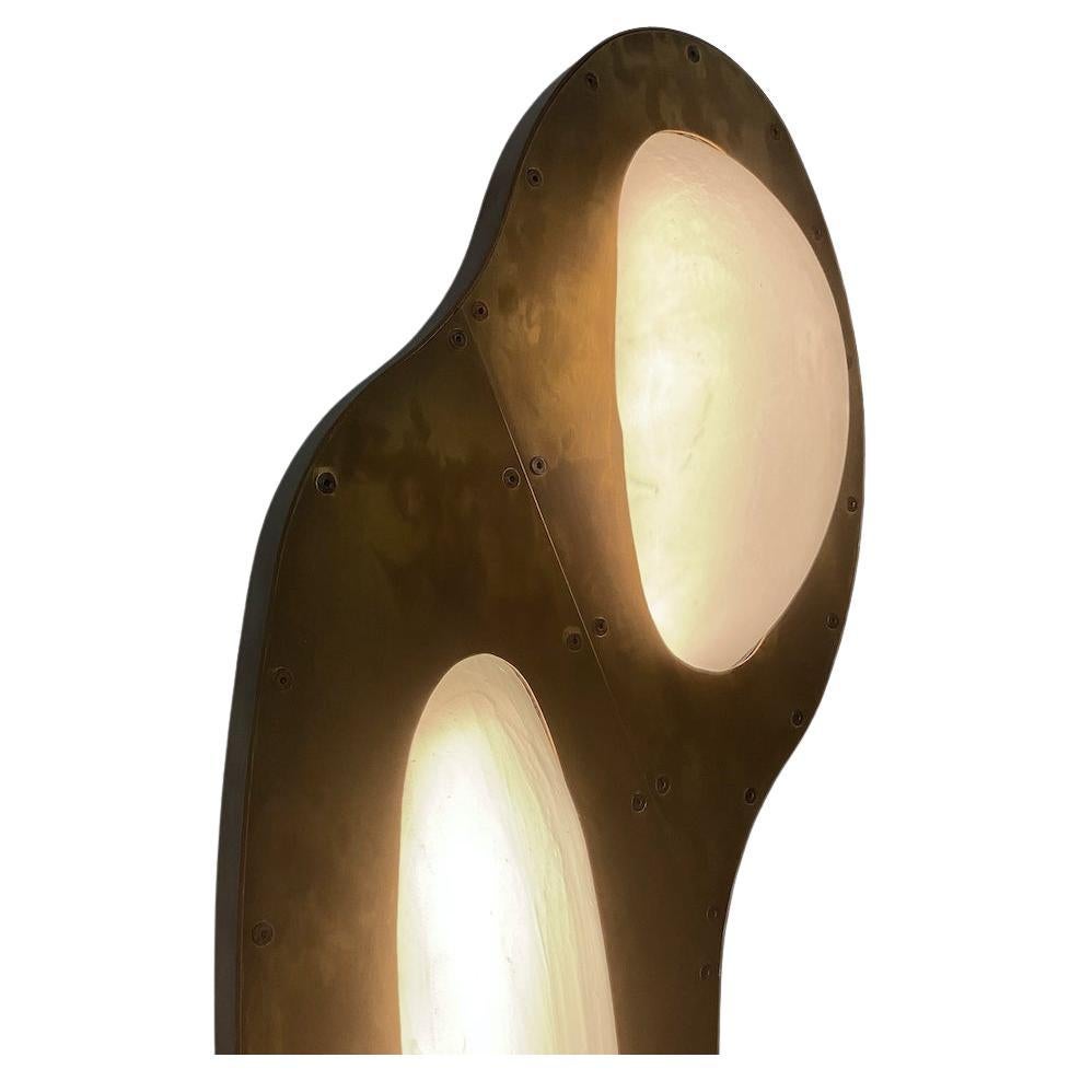 This is a custom sconce with a patina'ed brass body and slumped translucent glass forms. LED light bulbs within the fixture illuminate glass forms. Every single glass is unique. Choices of material are patina'ed brass or stainless steel bodies, and