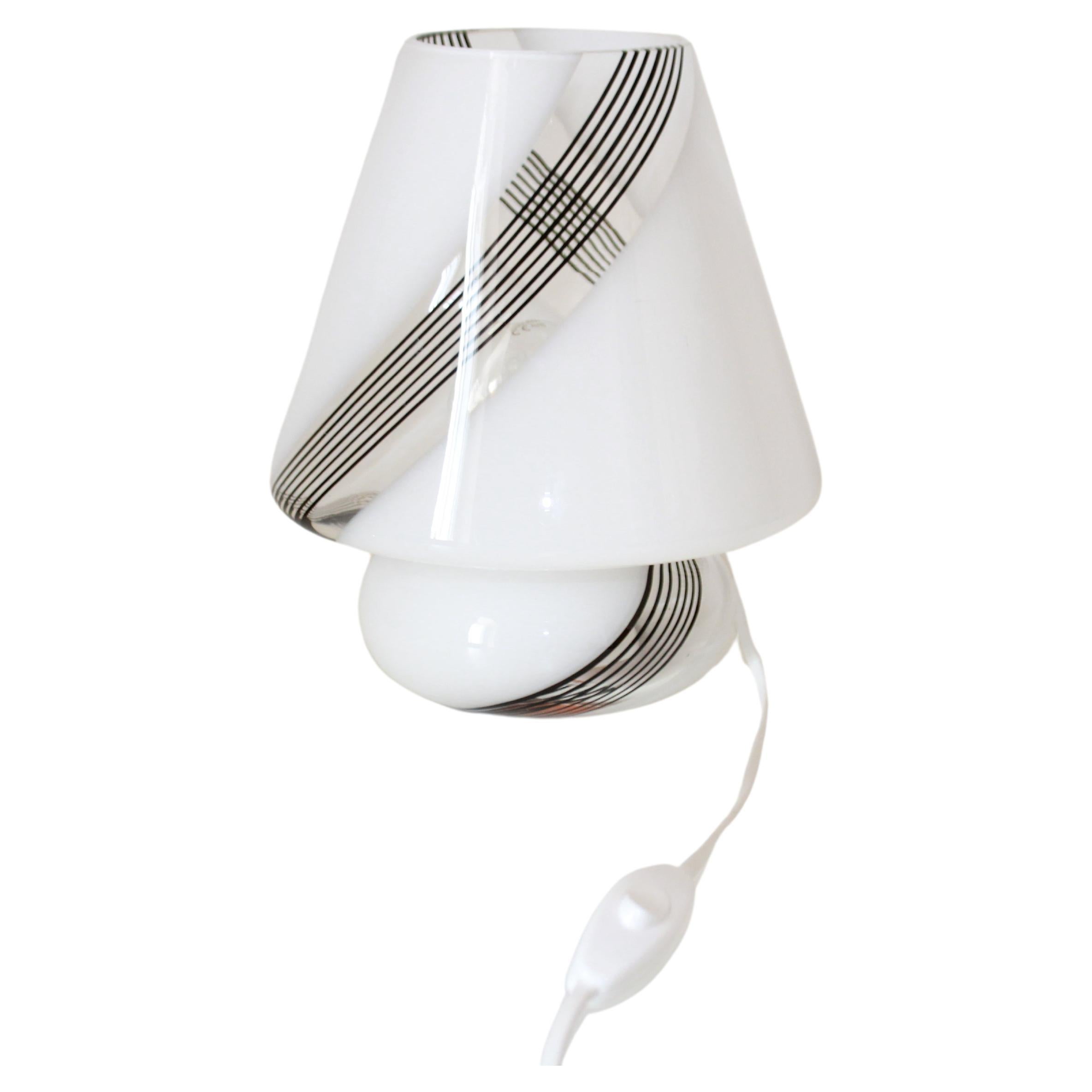 Vintage Murano Table Lamp, Italy 1960s
A really cosy late 1960' s vintage Murano glass table lamp. The lamp is characterized by beautiful and really unsual striated black and white glass pattern. In its distinctiveness, a typical piece of italian