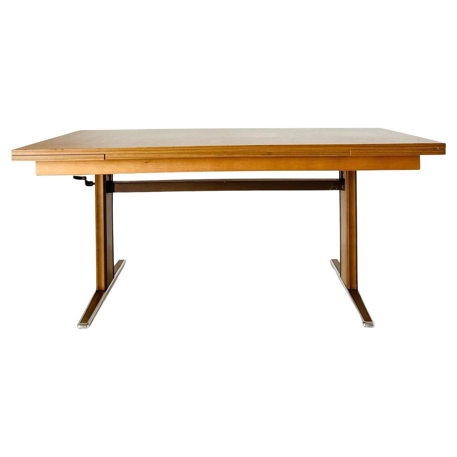 Vintage extendible coffee table, Italy 1970s.

Rare rectangular extendible coffee table with chrome feet. A mid-century Italian style vintage design piece. 

The table consists of a wood veneer top with the option to extend it either on the sides or