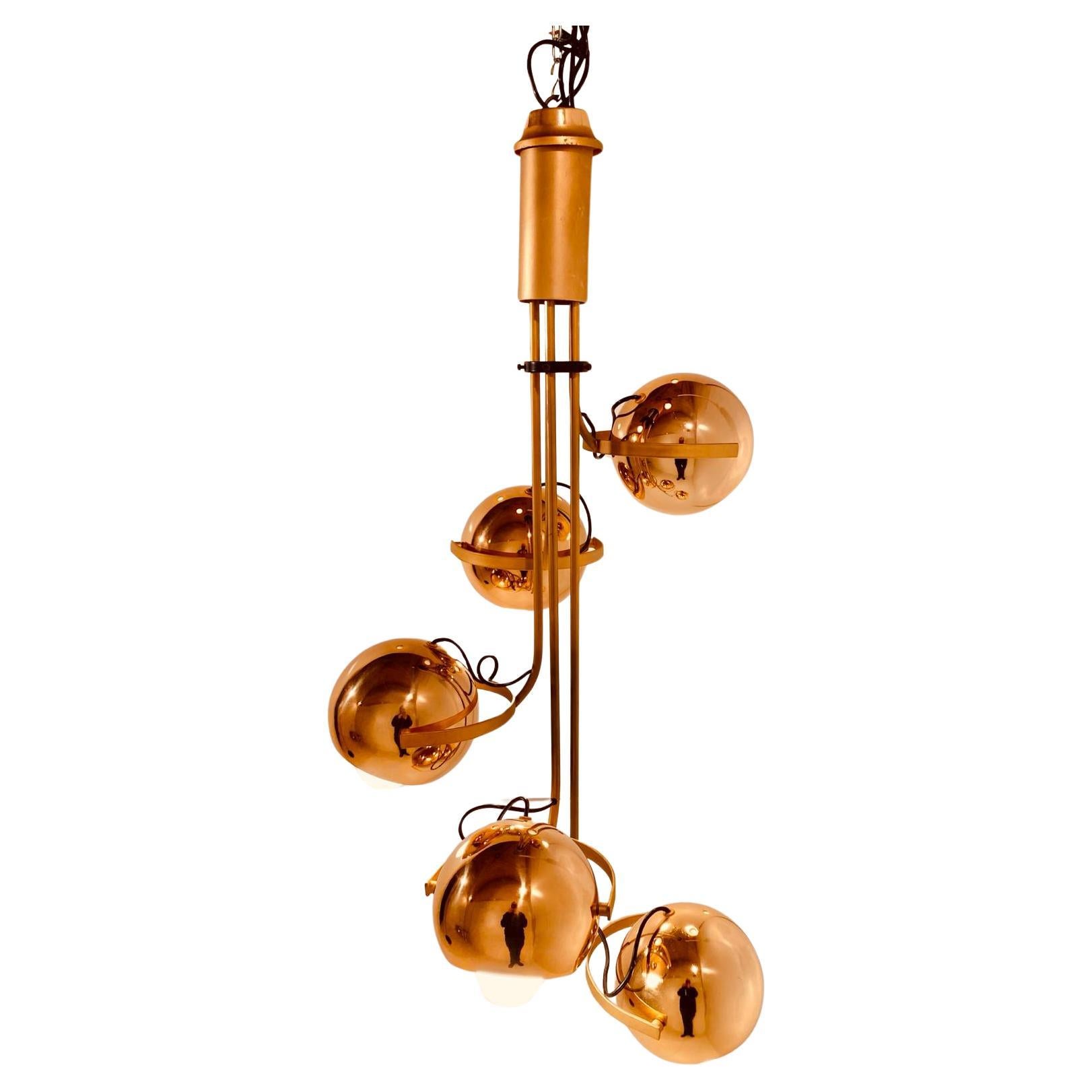 A beautiful 1960s golden chromed space age chandelier by Goffredo Reggiani. 
The lamp is composed by five adjustable lights spots with white inside surface. 
The lamp has been revised in all its parts and is perfectly working. E 27 lights bulbs. In