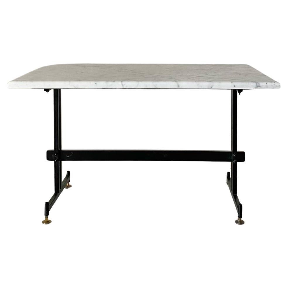 Vintage Carrara marble rectangular coffee table produced in Italy in the 1960s. Black iron structure with brass feet and Carrara marble top. Marble top has been refined and restored, structure has been repainted whilist brass feet has been polished.