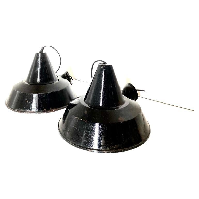 Industrial black steel lights, set of two. Manufactured in Italy in the 1950s, Black and white lampshade. Conservative restore made, beautiful signss of time (rusty) on the external parts. In very good conditions.