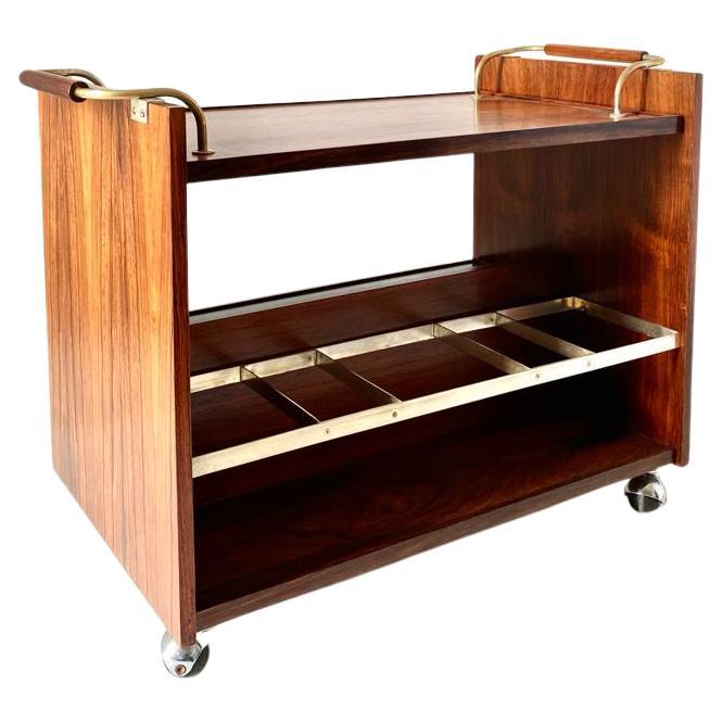 Rare vintage rolling bar cart with wood structure venereed in dark teak wood with chromed brass handles.  Removable top and shelves. Fully restored and in remarkable conditions with only few signs of time. 

Shelves depth: 21 cm

Please visit our