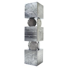 Mueble «Totem» moderno, diseñado por Andrea Salvetti para Dilmos, en aluminio fundido natural