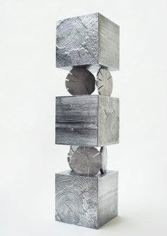 Mueble «Totem» moderno, diseñado por Andrea Salvetti para Dilmos, en aluminio fundido natural