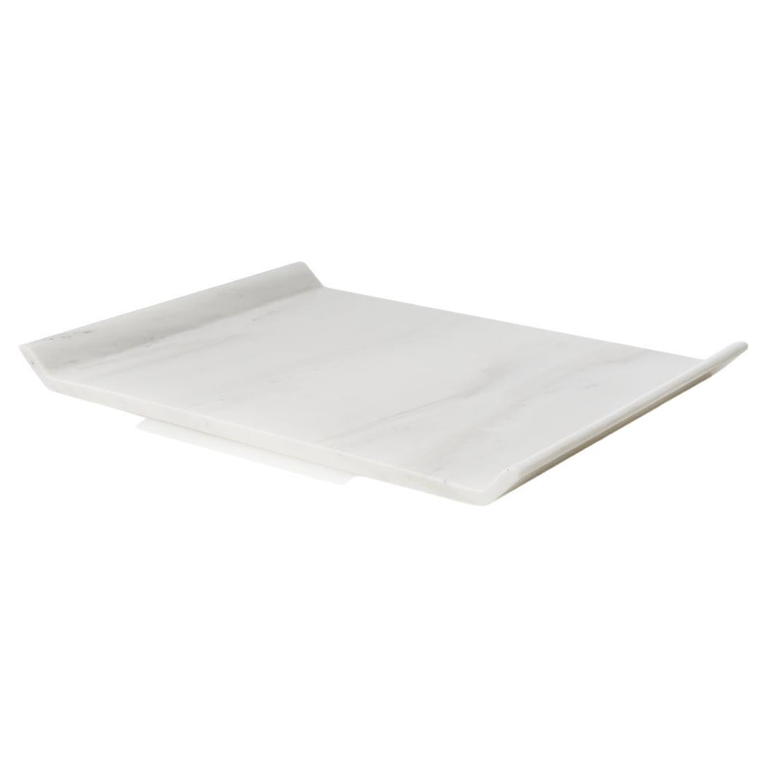 This platter is designed as a homogeneous volume, wishing to engage the senses around the plasticity of marble. It is carved off a single piece of marble without joints or seams.

Io platter has a fine mat finish, revealing the unique color and vein