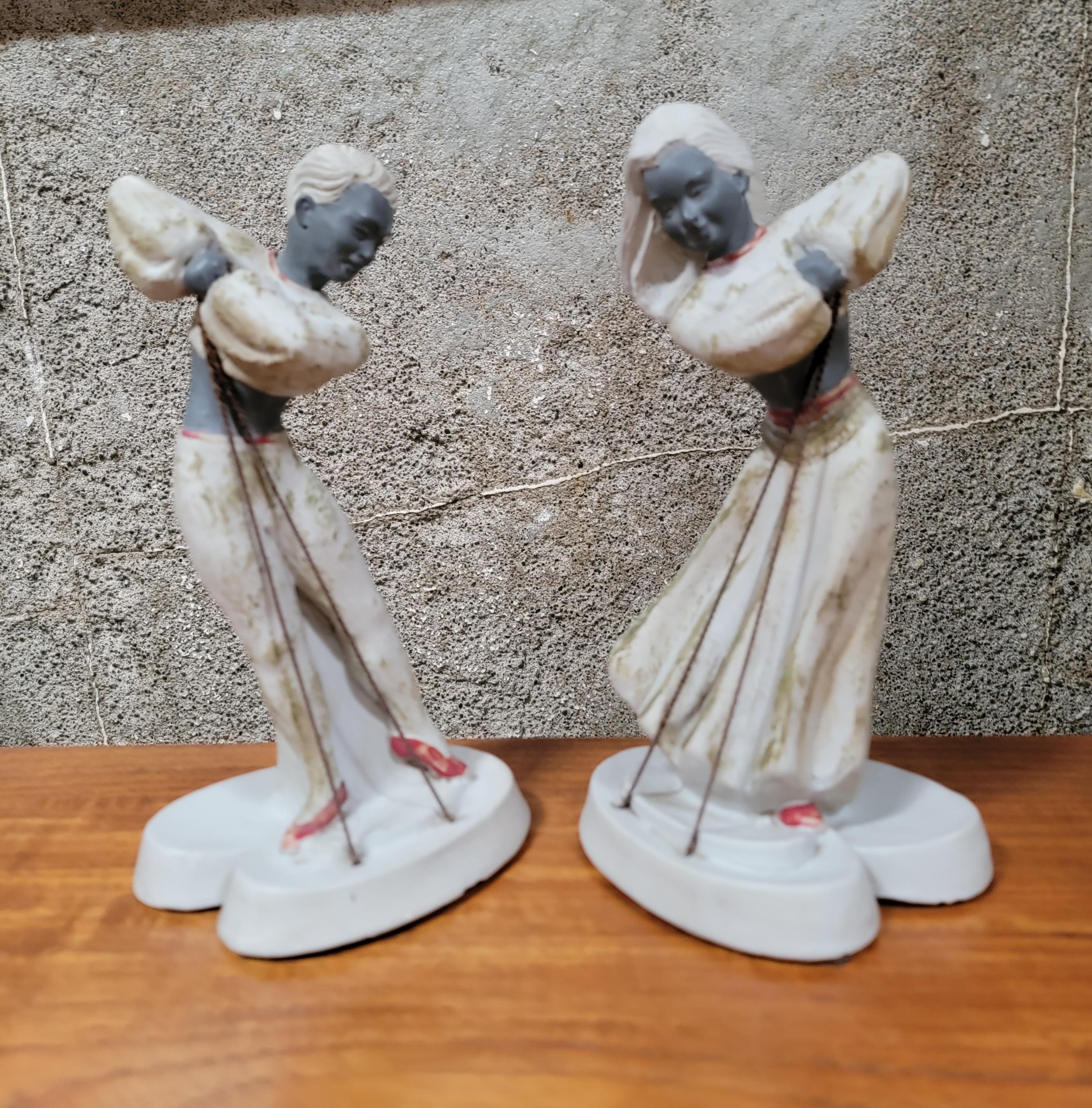 A pair of Chalkware dancing figures by Devonware, Canada. Circa. 1950's. 

9.38 inches high.
5 inches wide.
4 inches deep.