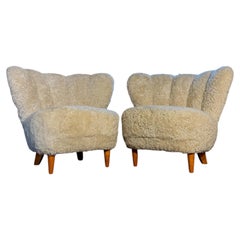 Pair of Carl-Johan Boman Lounge Chairs in Sheepskin and Wood, Finland, 1935