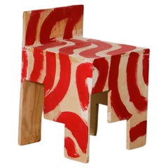 Kitsch Meets Judd Chairs in Red Wiggly Paint