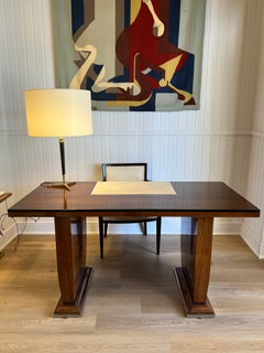 Art Deco rosewood desk by Jules Leleu with a central parchment writing surface