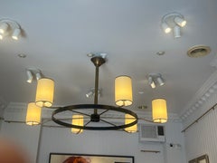 Large circular six‑light chandelier by Jacques Adnet, France, circa 1950