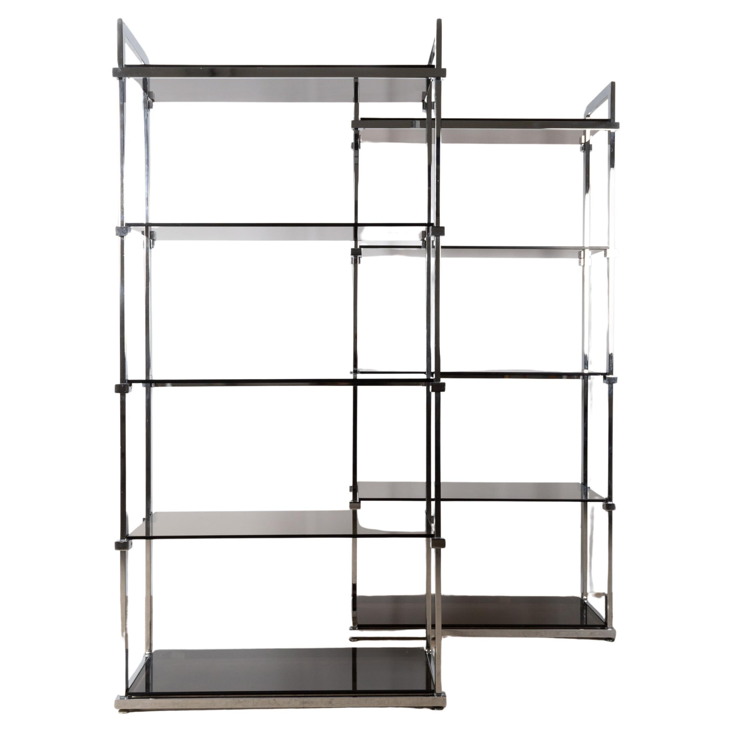 Midcentury Chrome and Glass Étagère Display Shelves, England, circa 1970

étagère with a chrome frame and smoked glass. Designed by Tim Bates for the Lisse Range.
A pair available.

Excellent condition commensurate of age. Nibbles to the corners and