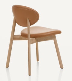 Silla ovoide de roble macizo, efecto crudo y piel de Craig Bassam