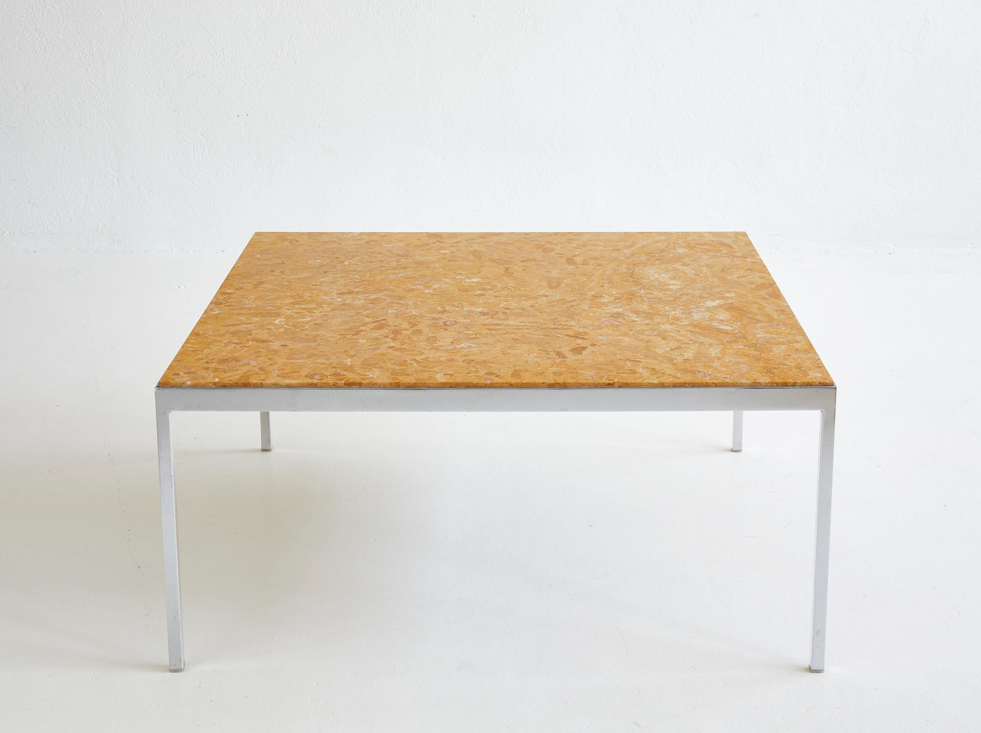 Large minimalist 1960-1970 coffee table with top in yellow marble.

The base structure is in chromed metal and stands out for its slim, refined design.

The square top is in yellow marble and sits inside the metal frame, protruding just a few