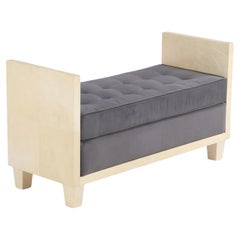 A large parchment covered upholstered bench in the manner of Jean-Michel Frank.