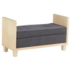 A large parchment covered upholstered bench in the manner of Jean-Michel Frank.
