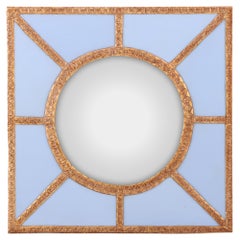 A Bold Geometric Blue Glass and Gold Resin Convex Wall Mirror