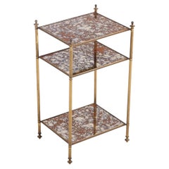 Mesa francesa de latón y cristal de 3 pisos, c. 1950.