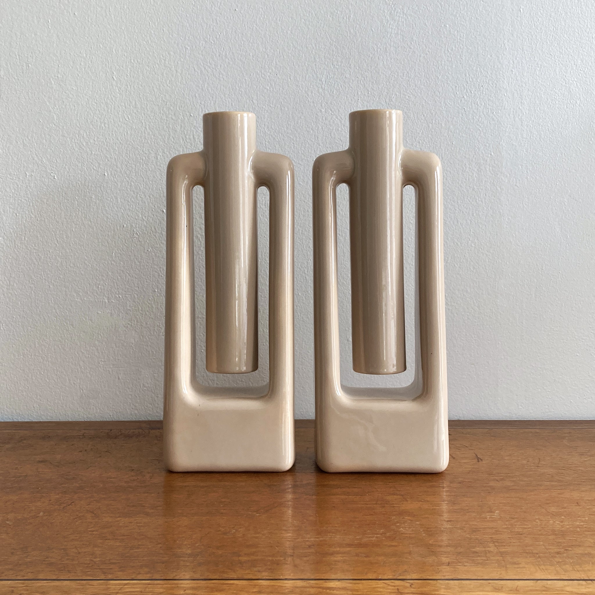 A stunning and rare pair of abstract midcentury style Haeger beige/ ecru vases, medium size. In great condition, no crazing or cracks. This pair coordinates with three other matching vases, listed separately, see photos. Beautiful as a pair, or