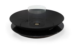 Caminetto da esterno con base in acciaio al carbonio nero e marmo nero marquina