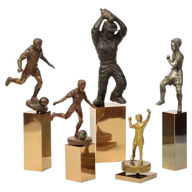 Early 20th Century, A Set of Burmese Bronze Sportsman Figurines