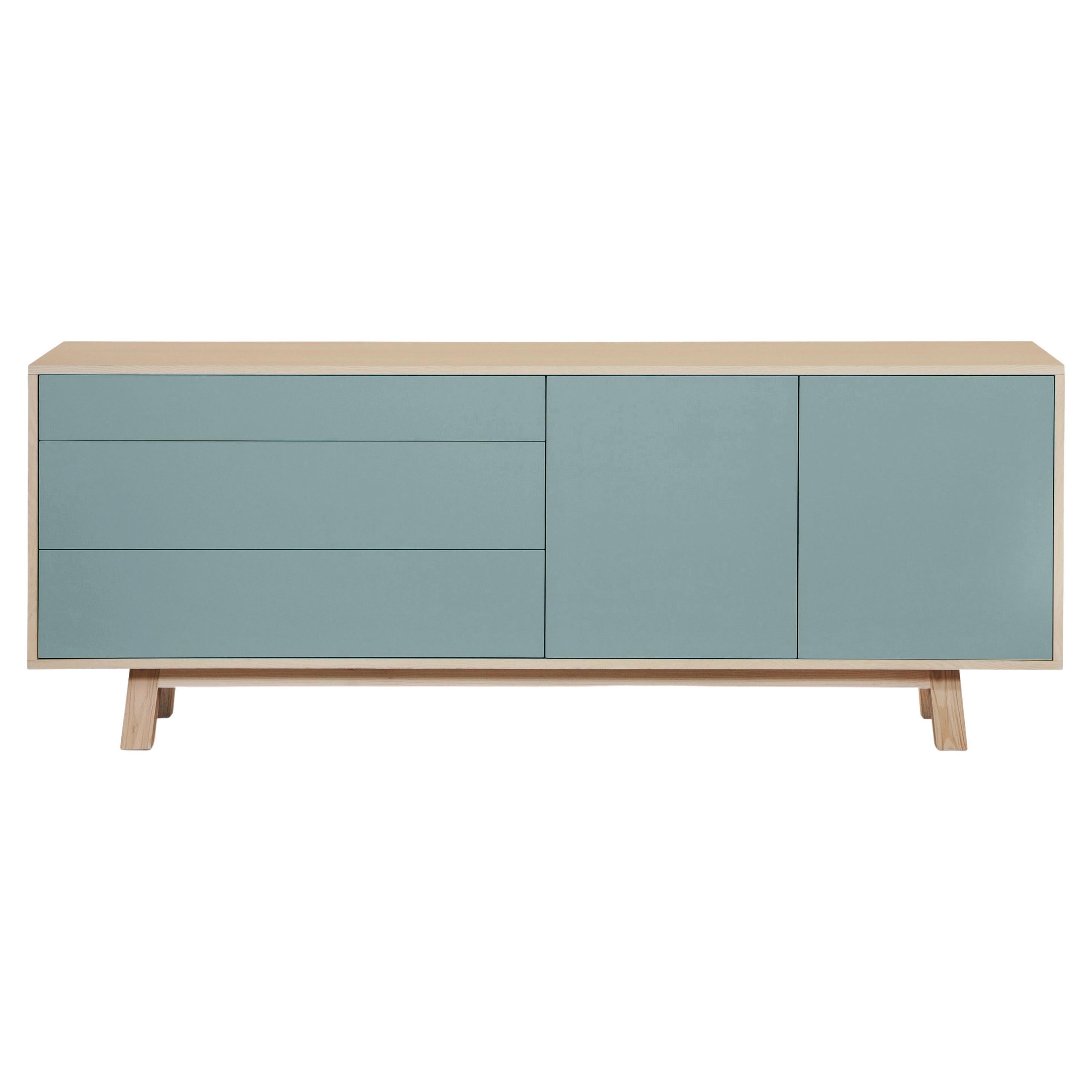 This 2 doors and 3 drawers sideboard is designed by Eric Gizard - Paris.

It is 100% made in France with solid ash wood, veneer and lacquered doors in MDF panels. 

The 2 doors open with a 