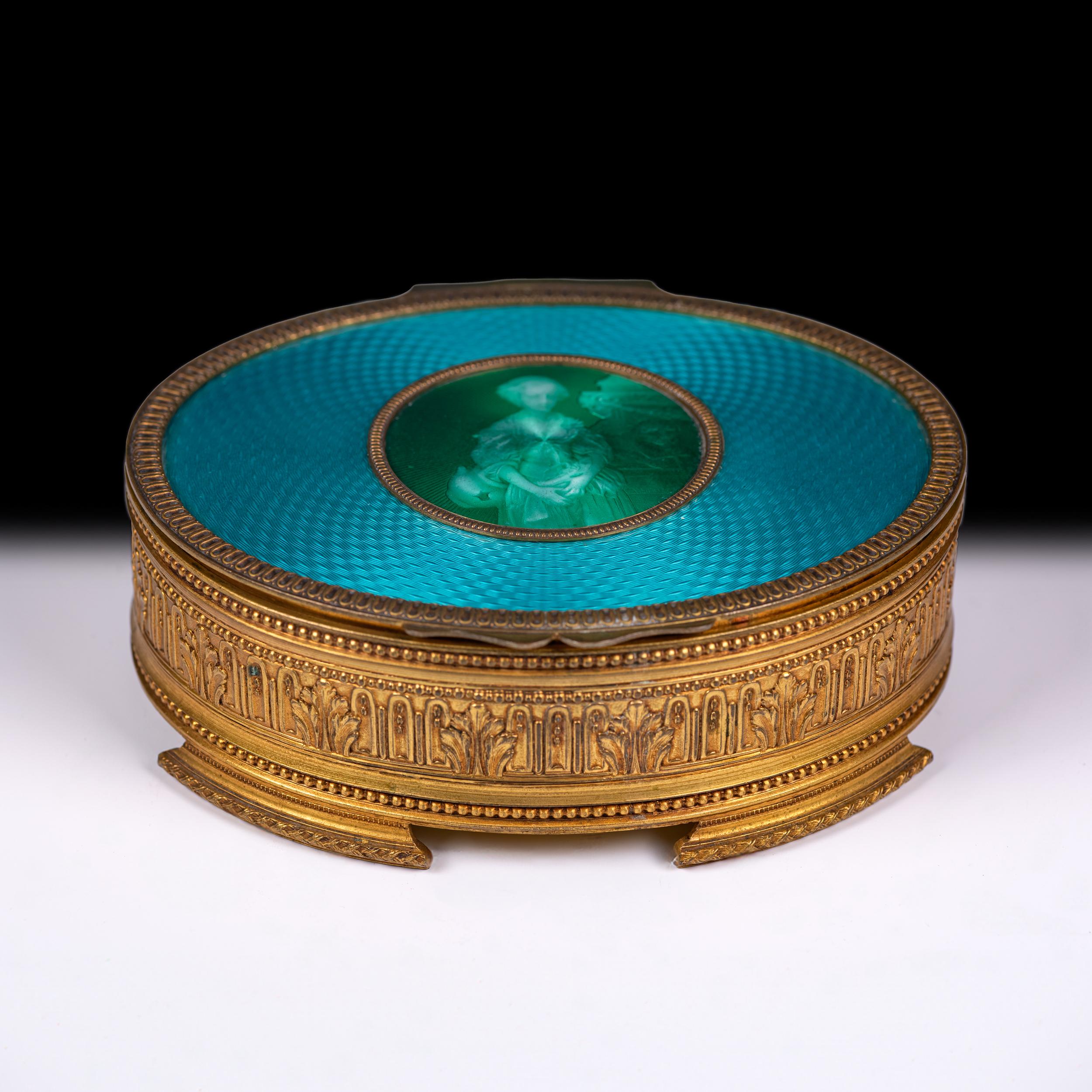 A superbly crafted circular gilt bronze box of exceptional quality, featuring a rich turquoise-blue guilloché enamel top centered with an oval medallion bearing a finely hand-painted portrait miniature of an 18th-century lady in court dress,