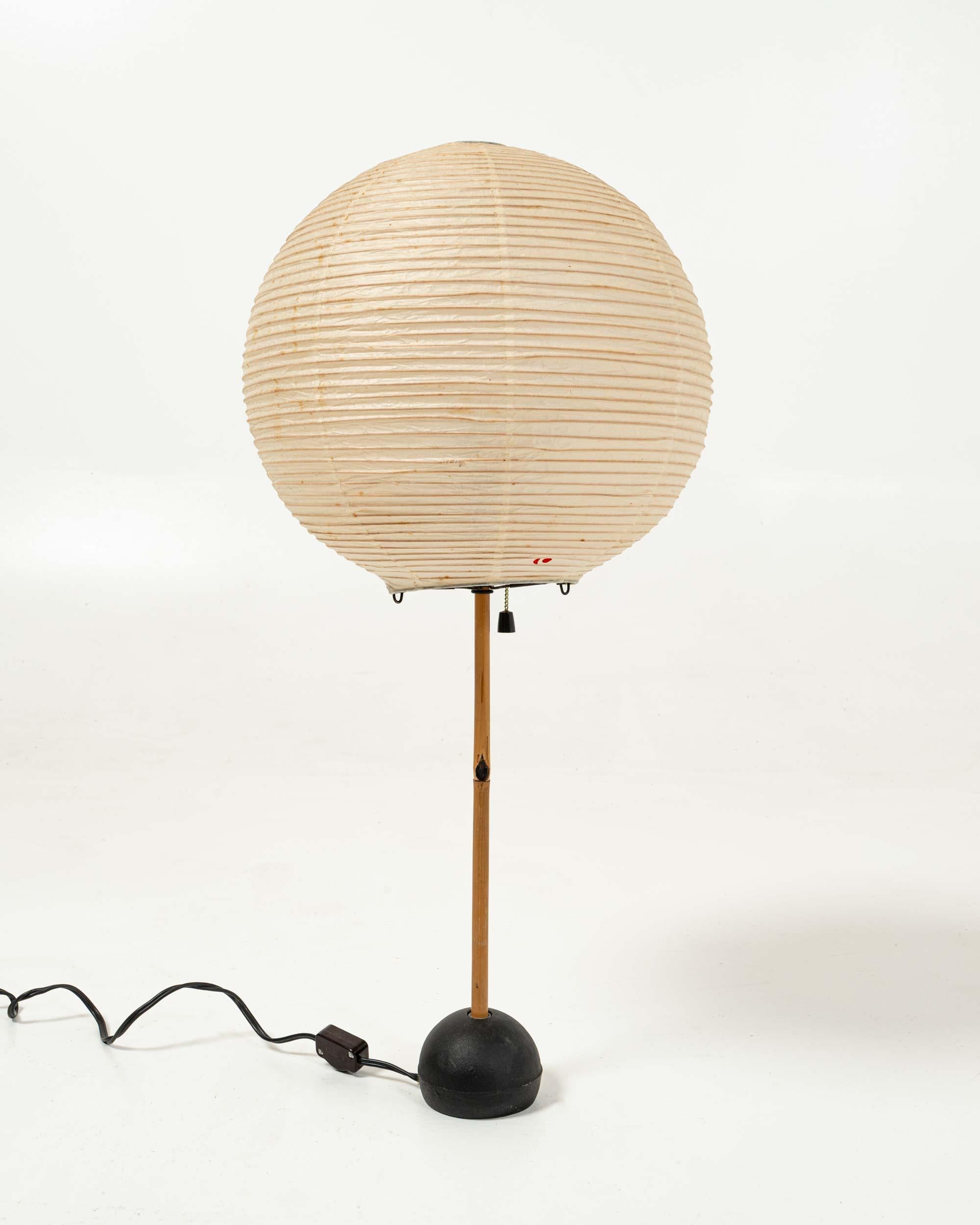 A great early vintage example of Isamu Noguchi's Light sculpture Table Lamp BB1-30A. Original packaging for the 30A shade with 30A stamp on the end of the box 

The bright red Sun and Moon stamp on the shade indicates that this is the earliest