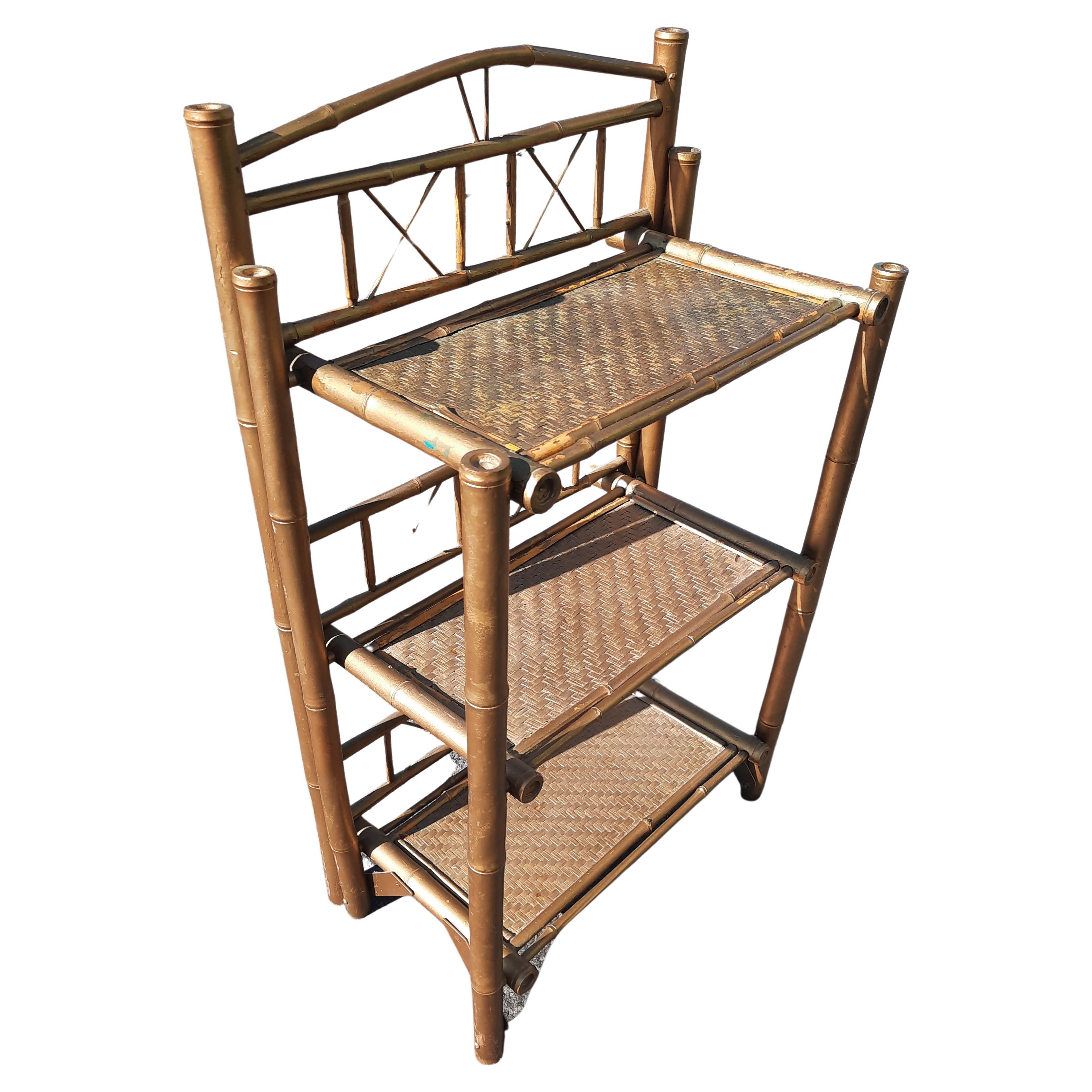 Antique tortoise bamboo and Woven Wicker Etagere bookshelf. Bamboo rods and woven wicker shelves make this etagere shelving unique. This Boho chic style provides wonderful rustic visual effect, yet lends itself to both chinoiserie and modern