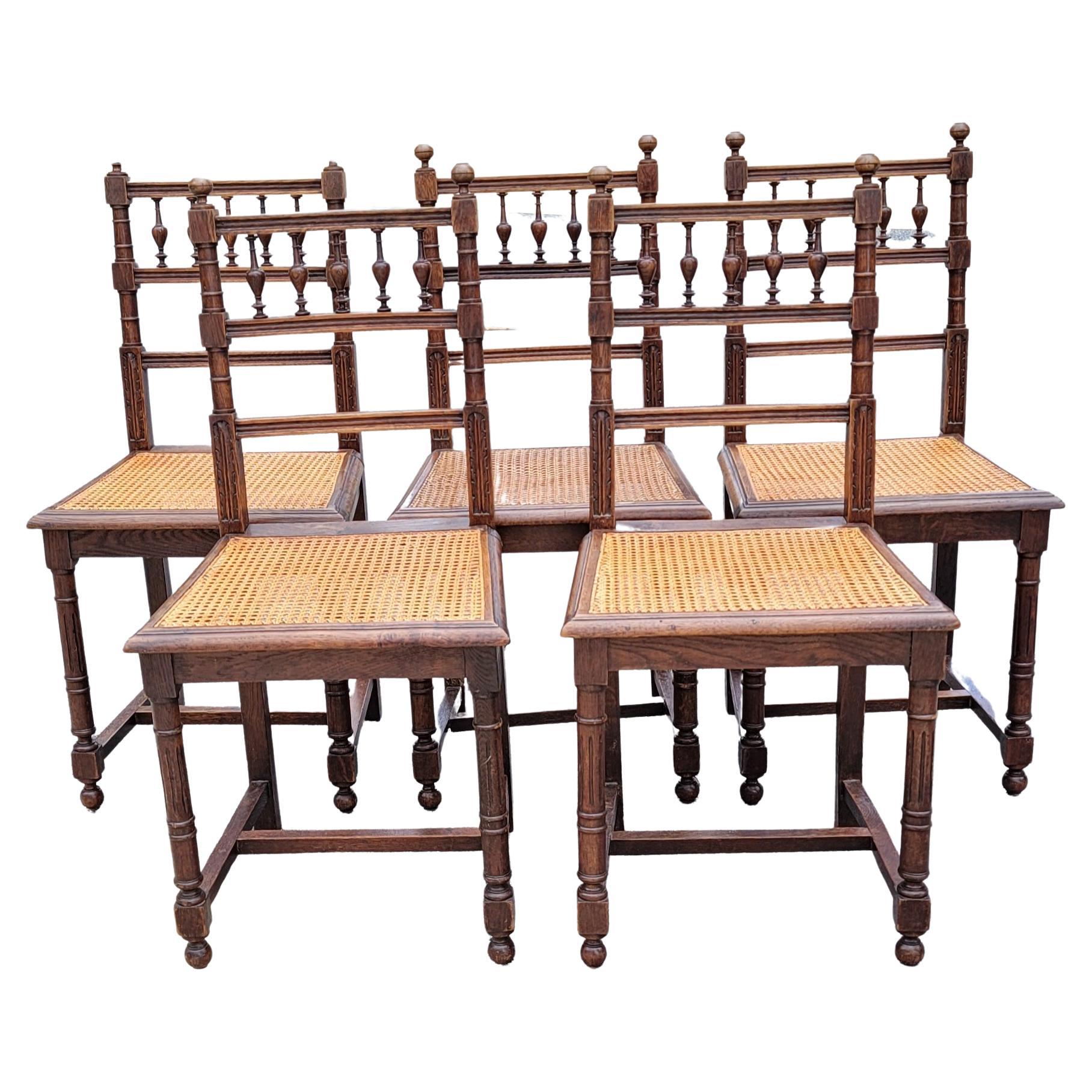 A beautiful set of 5  of French Renaissance  Henry II style chairs from the turn of the twentieth century.
Solidly made of oak wood,  braided cane seats , backrest decorated with intricately hand carved balusters.
Made of very good quality wood.