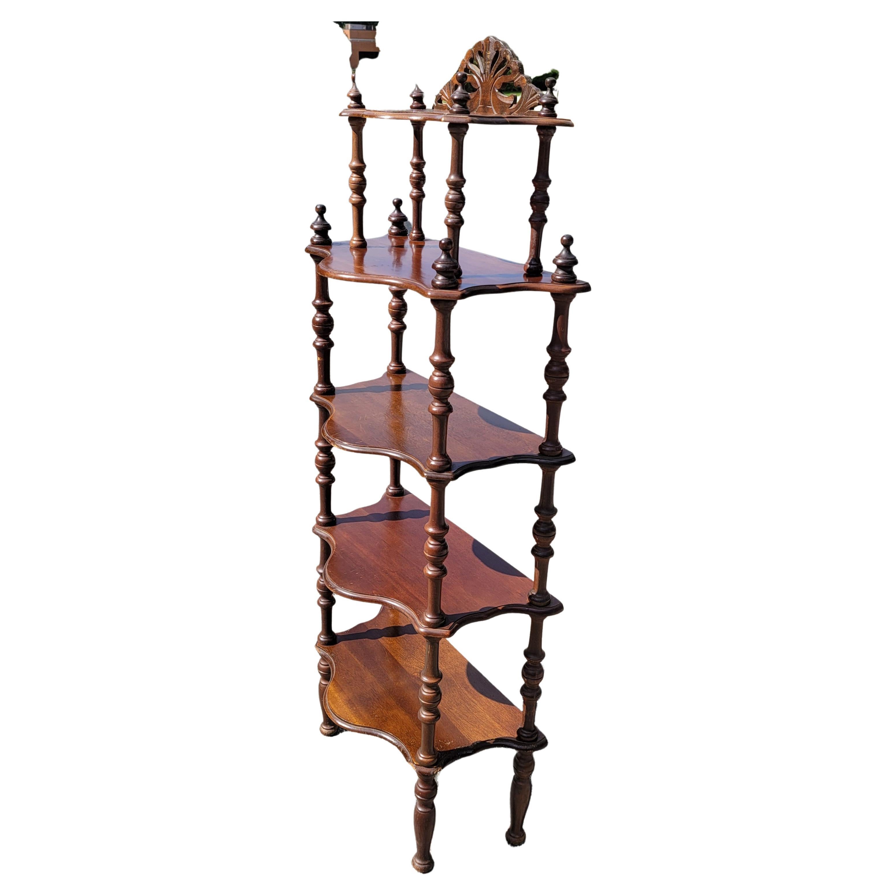 A patinated Antique English Regency Style mahogany Narrow Etagere in good condition. 
Great for displaying arts and other ornamental objects.
Measures 53.75