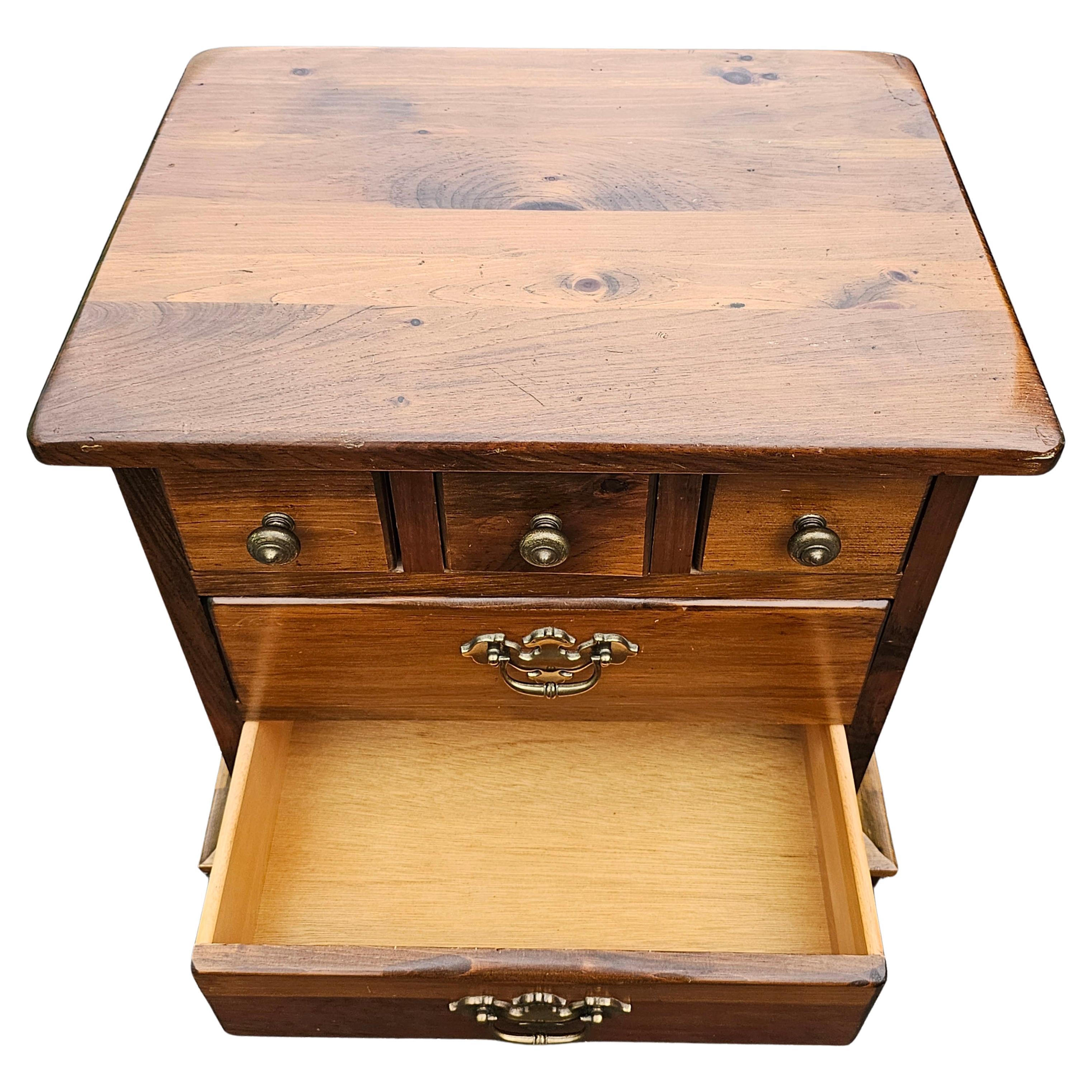A Mid-20th Century Solid Pine Five-Drawer Bed Side Table Nighstand finished on all sides, Features 3 small top drawers and large lower drawers. Measures 22.5