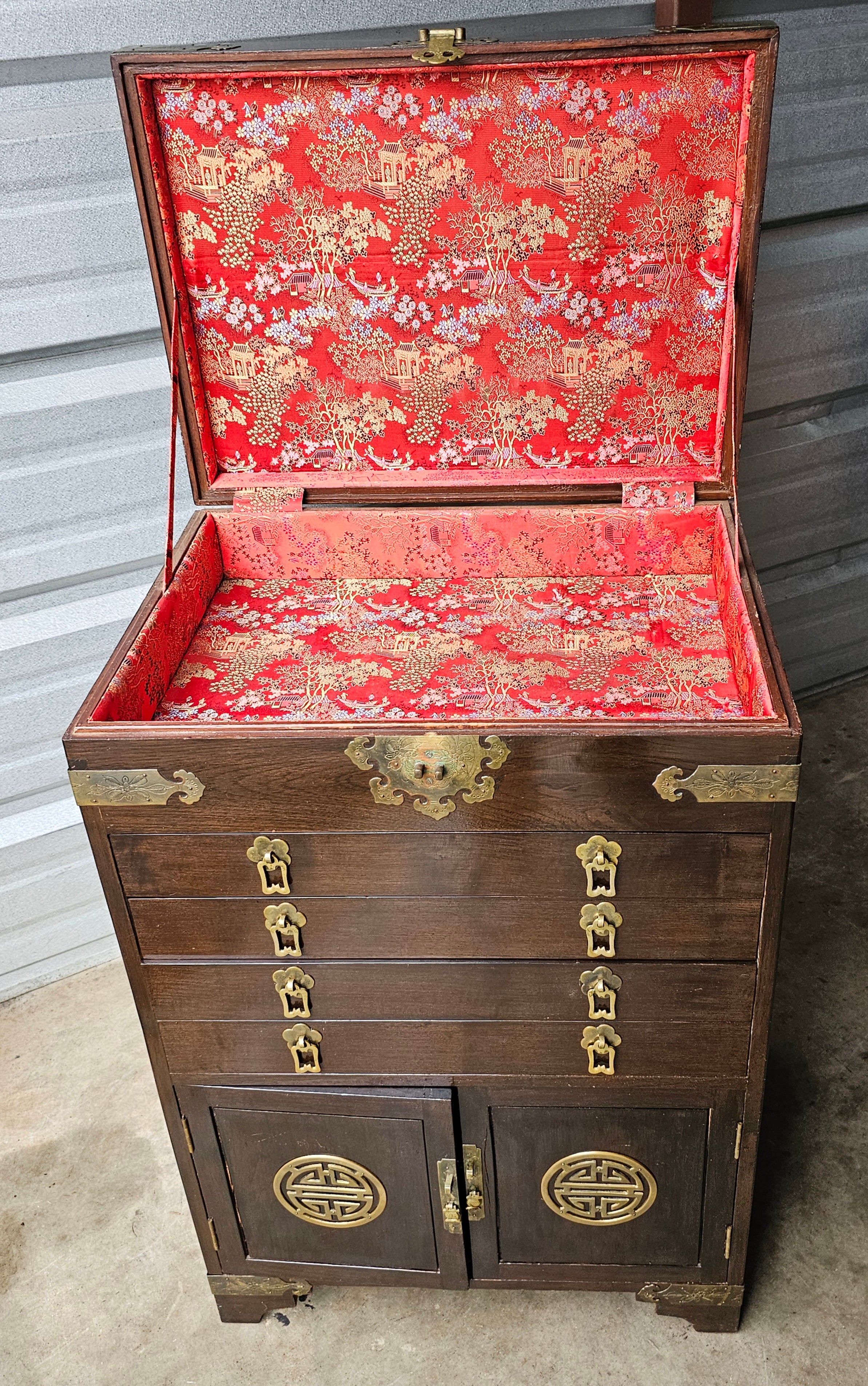 A late 19th  Century to Ealy 20th Century Chinese Export Walnut Brass Mounted Hardwood Silver Chest  or  Jewel Chest in great vintage condition. Soft Chinese motif textile lined interior. Features flip top compartment, textile line, above 4 textile