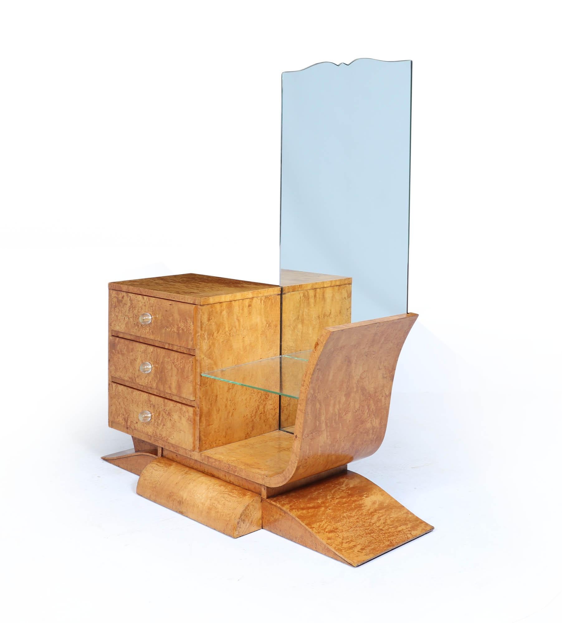 A standout piece of 1930s Art Deco design, this original burr maple dressing table offers a bold combination of sculptural form and luxurious material. With its rich, swirling grain, elegant curvature, and balanced symmetry, it reflects the opulence