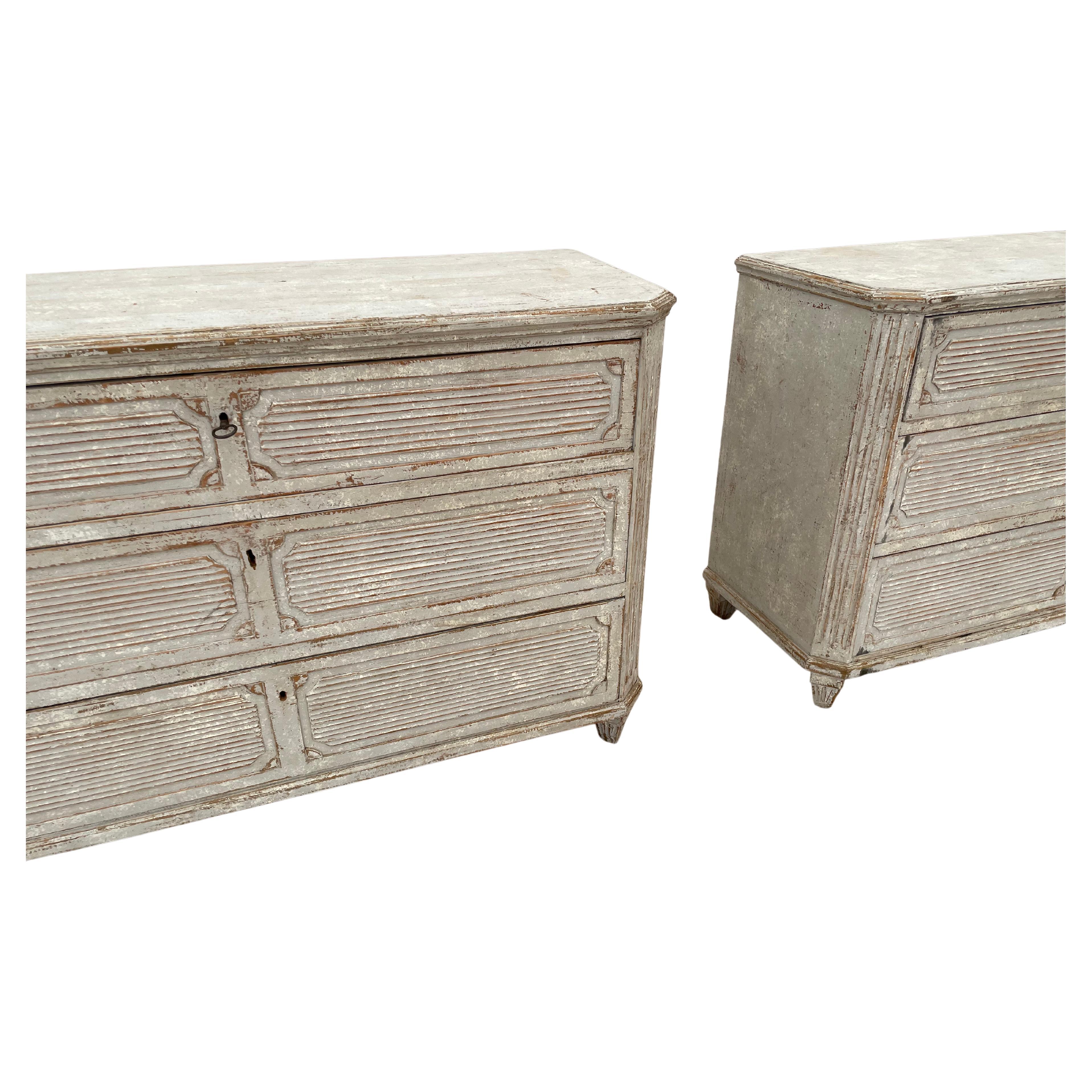 Amazing and rare grande pair of Swedish Gustavian commodes in a white and gray color palette. These are stunning and are a complete showstopper. Pair these in any design space and they will stand out as a statement piece. Imported from Europe and