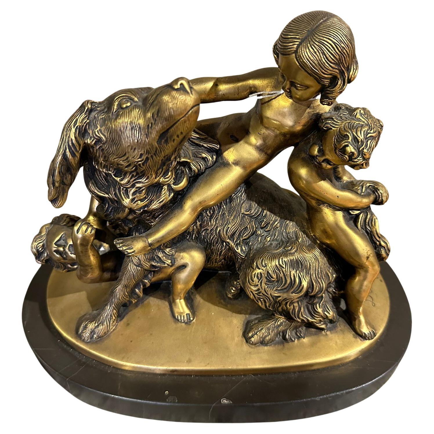 EDOUARD DROUOT (1859-1945)  Groupe sculptural en bronze doré signé