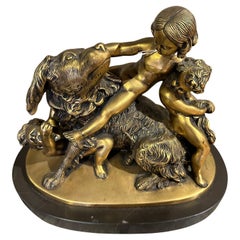 EDOUARD DROUOT (1859-1945)  Groupe sculptural en bronze doré signé