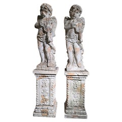 Pair of Monumental 19th Century Italian Terracotta Musical Cherubs on Pedestals