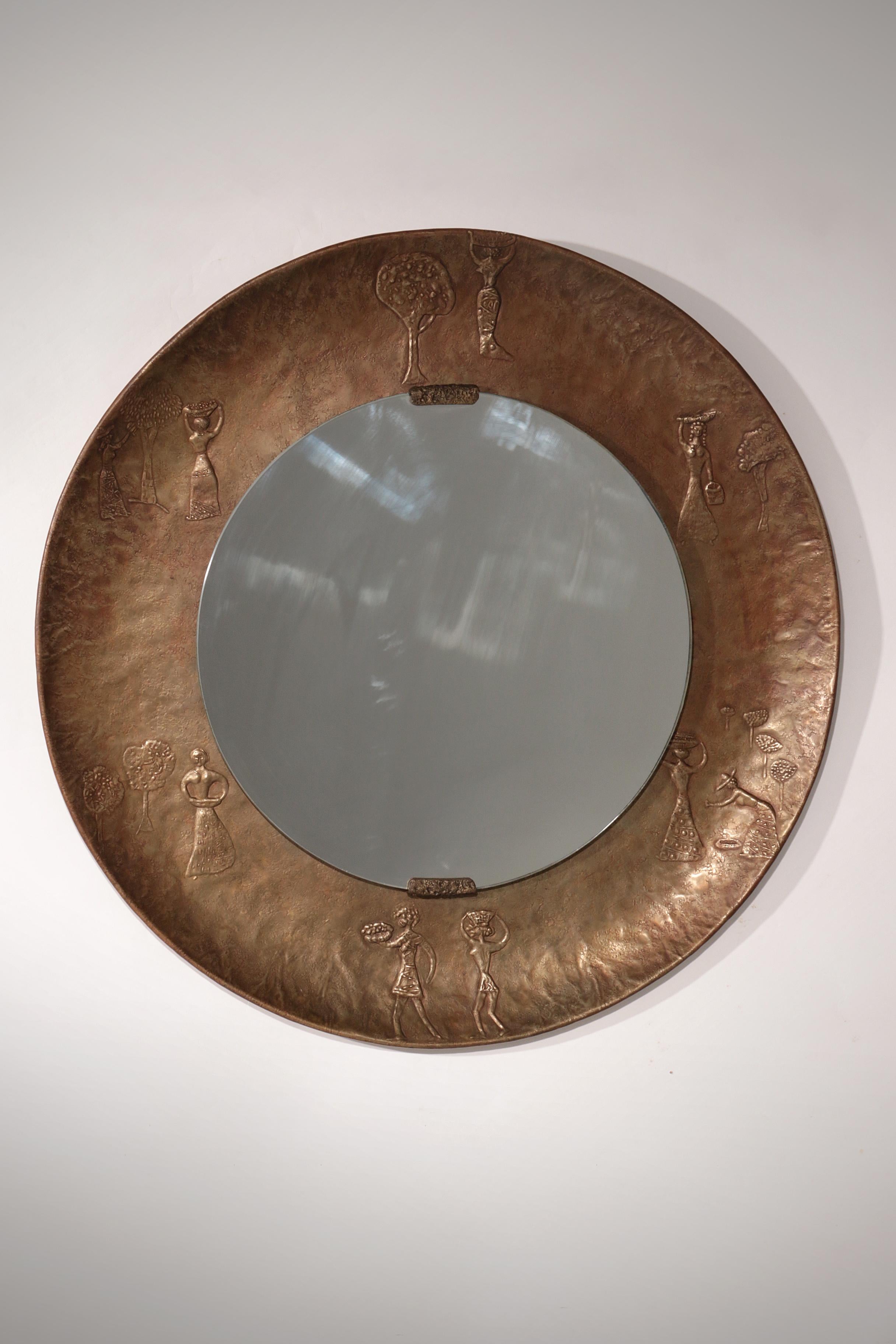

Step into the world of mid-century Italian artistry with this extraordinary hammered copper mirror, attributed to the renowned designer Angelo Bragalini. Crafted in the 1950s or 60s, this piece is more than a mirror—it is a sculptural statement.