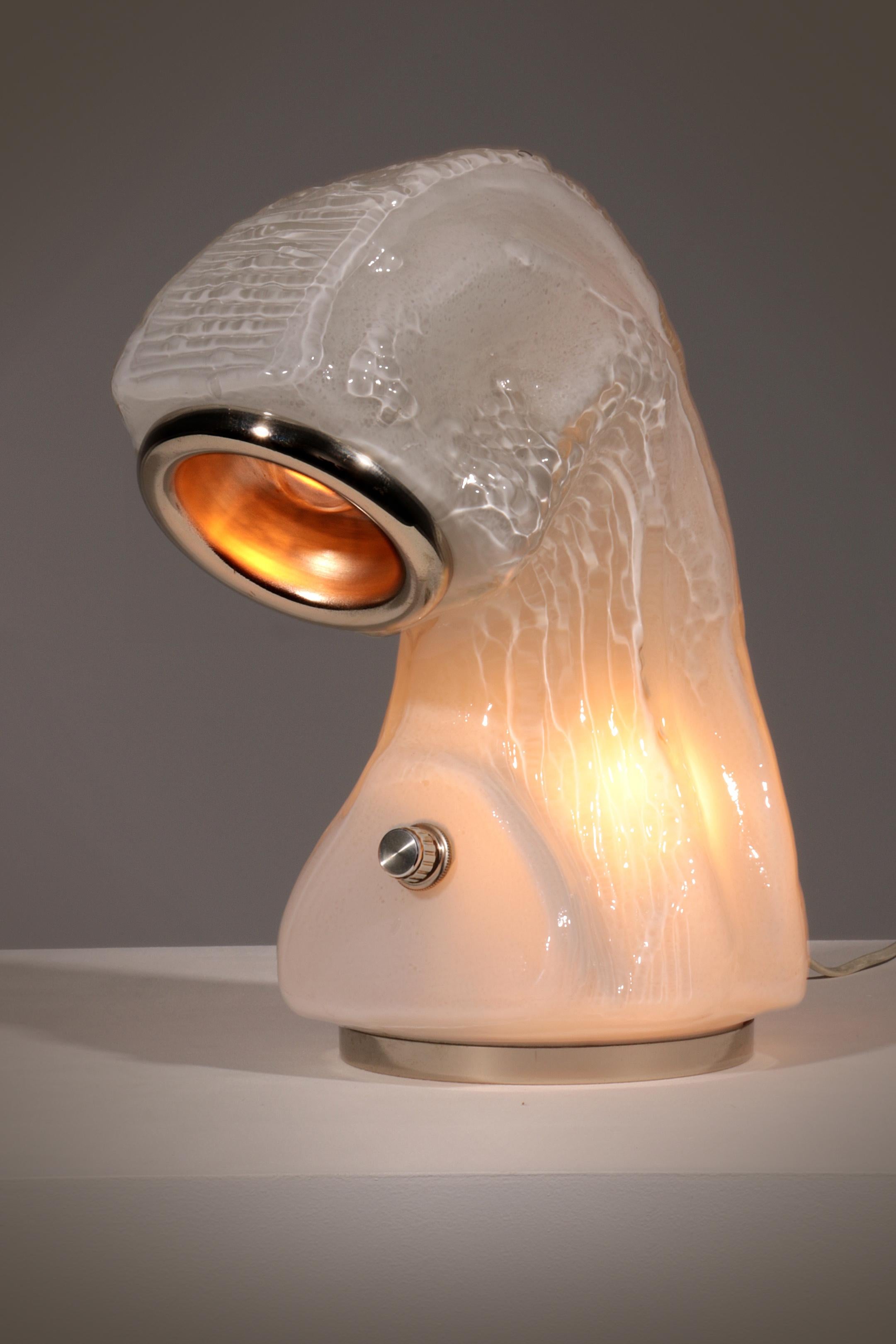 Osso (Bone) Murano glass bark effect table lamp by Carlo Nason for Mazzega. This lamp is part of biomorphic free-form shaped glass shells, this piece features a milky glass diffuser with a thin steel basement that creates an iceberg visual effect.