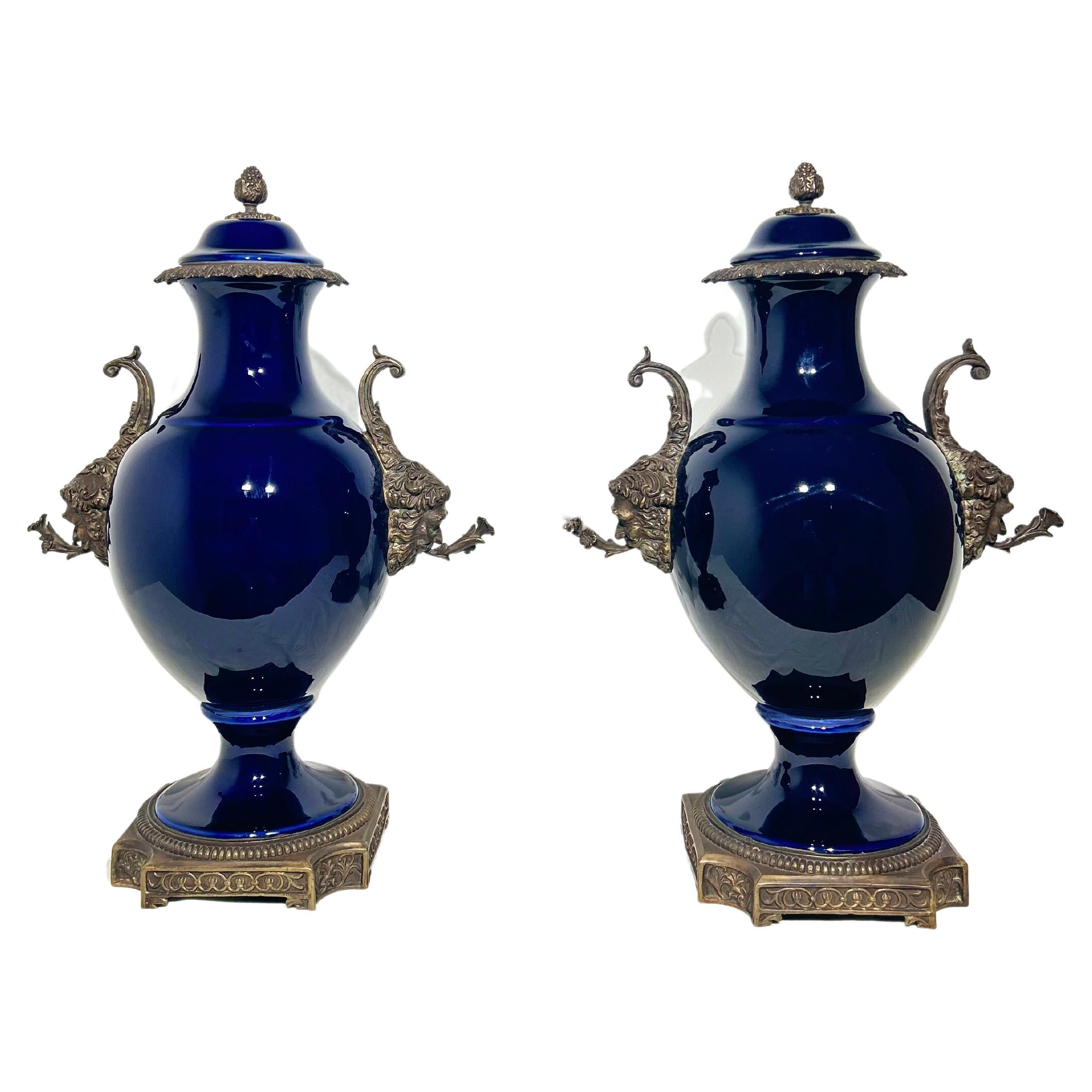 Pair of 20th Century China Urns with Bronze Mounted Handles Depicting Bacchus
