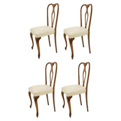 Lot de quatre chaises de collection en noyer, années 1960