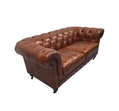 A Fabulous Leather Chesterfield Two Seater Couch in the Victorian Manner