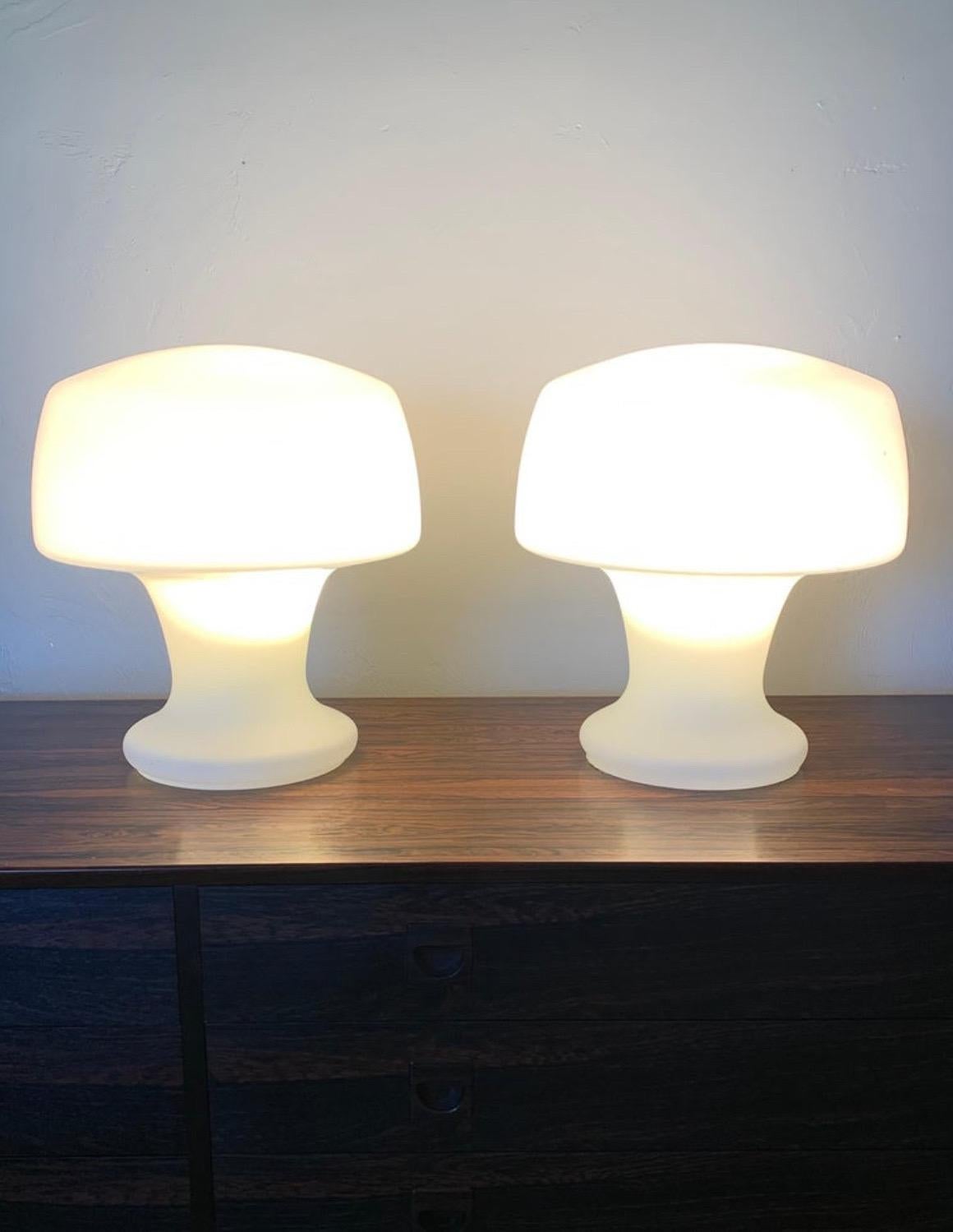 Fantastic pair of Laurel studio mushroom table lamps. Hand Blown opaque white glass forms a unique sculptural mushroom shape. Made from on solid piece of glass with a cord and switch to turn it on and off. True vintage piece.

Mid century modern in