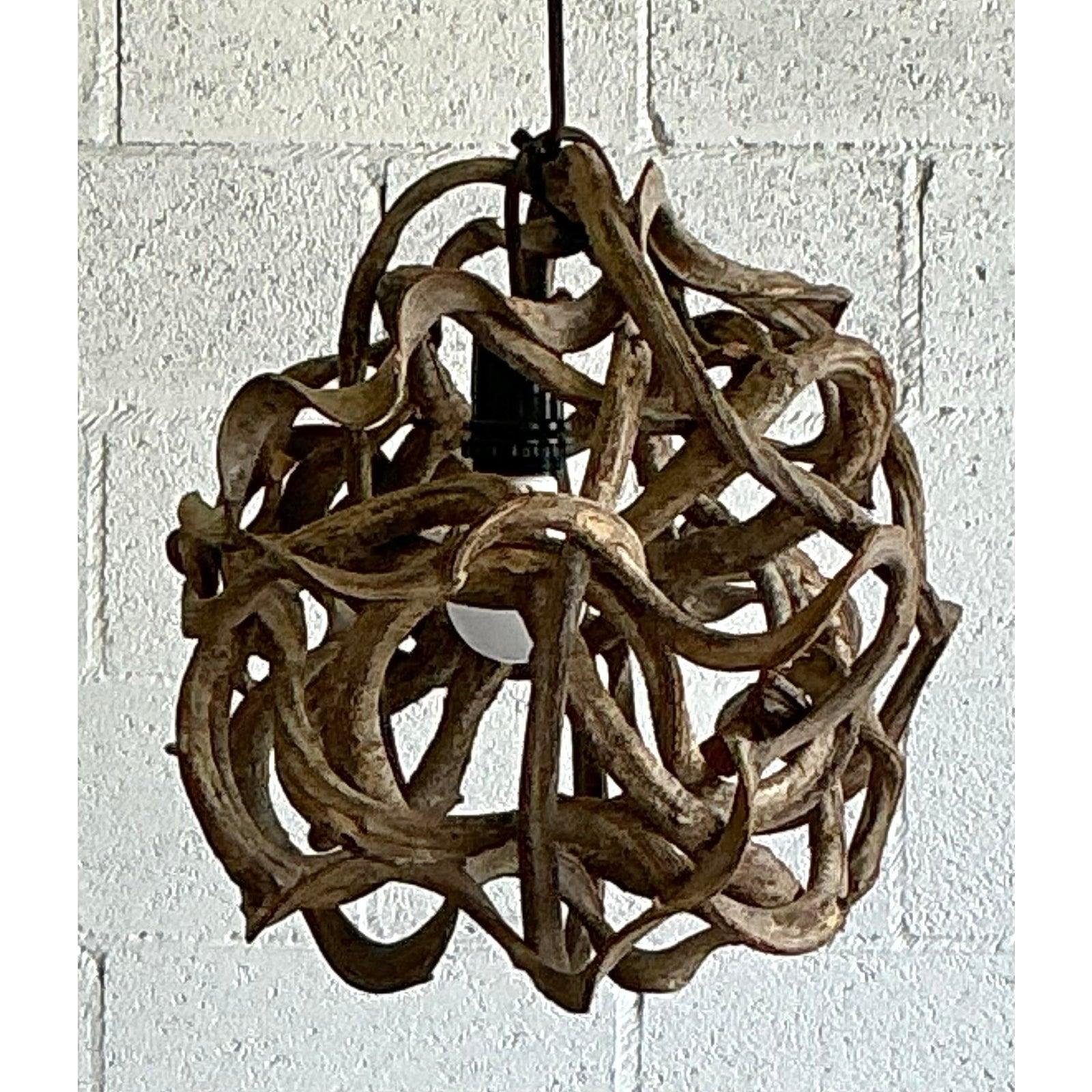 Discover the captivating, sculptural charm of this vintage root ball pendant lamp, a testament to raw natural artistry. This unique fixture is meticulously crafted from organically shaped, intertwined roots or vines, forming a beautifully chaotic