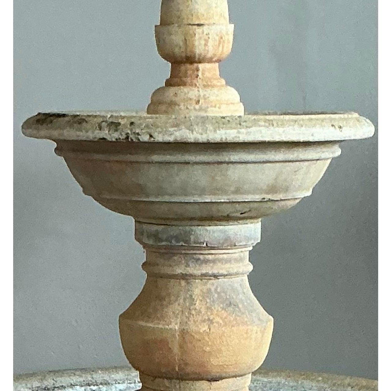 Create a timeless European-style oasis in your own backyard with this magnificent two-tiered fountain. Expertly crafted from heavy, durable cast stone, this piece features a classic baluster-style pedestal, two generous basins, and a stately acorn